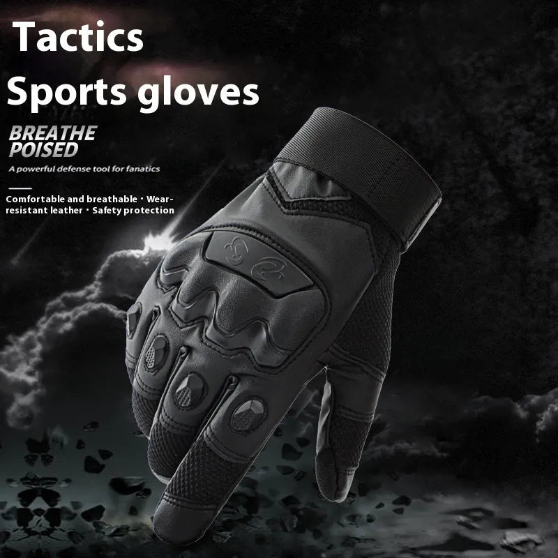 Men's black tactical gloves with touch screen fingertips on a hand holding a smartphone