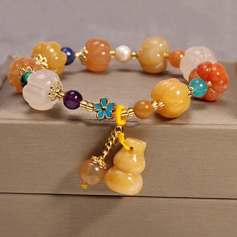 Khaki coloured crystal bead bracelet for women on a gold silk cord, showing Japanese and South Korean style.