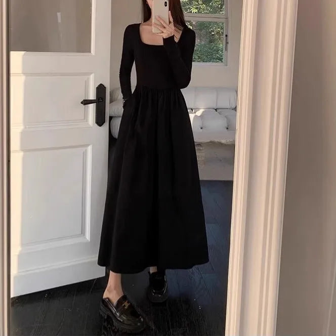 Women's black knitted dress with square collar, long sleeves, elastic waist, and A-line skirt.