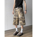 Yellow denim jeans with snake camouflage pattern, cropped length design