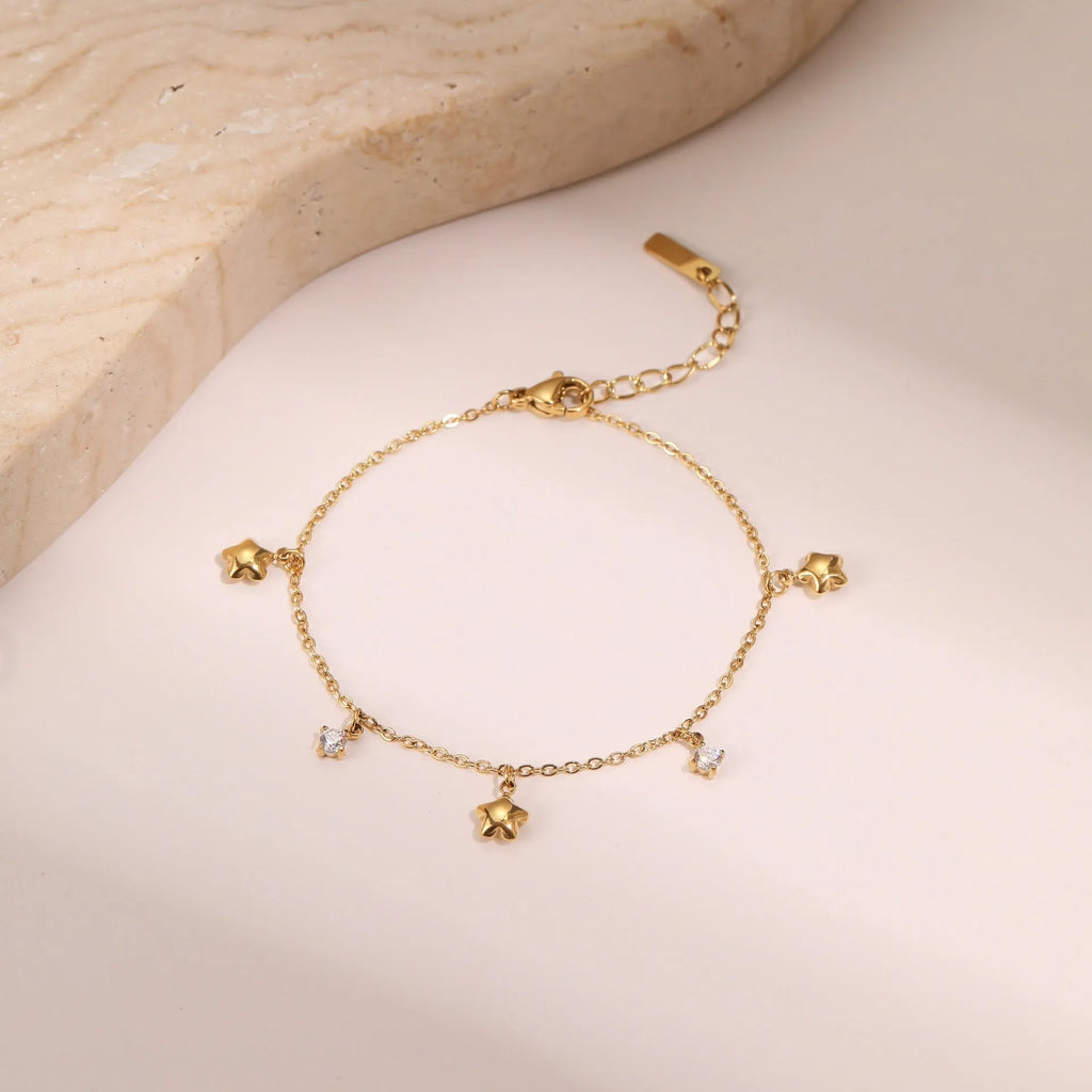 Gold-plated stainless steel bracelet with a hexagonal zircon star pendant for women.