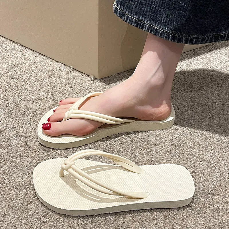 Men's casual flip flops with toe covering in PVC material, showing non-slip sole pattern and full foot enclosure design