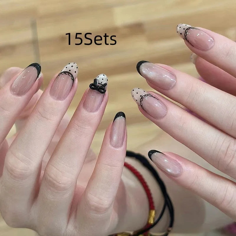 Set of sweet girl theme fake nails with colourful glitter and crystal decorations on a soft gel base.