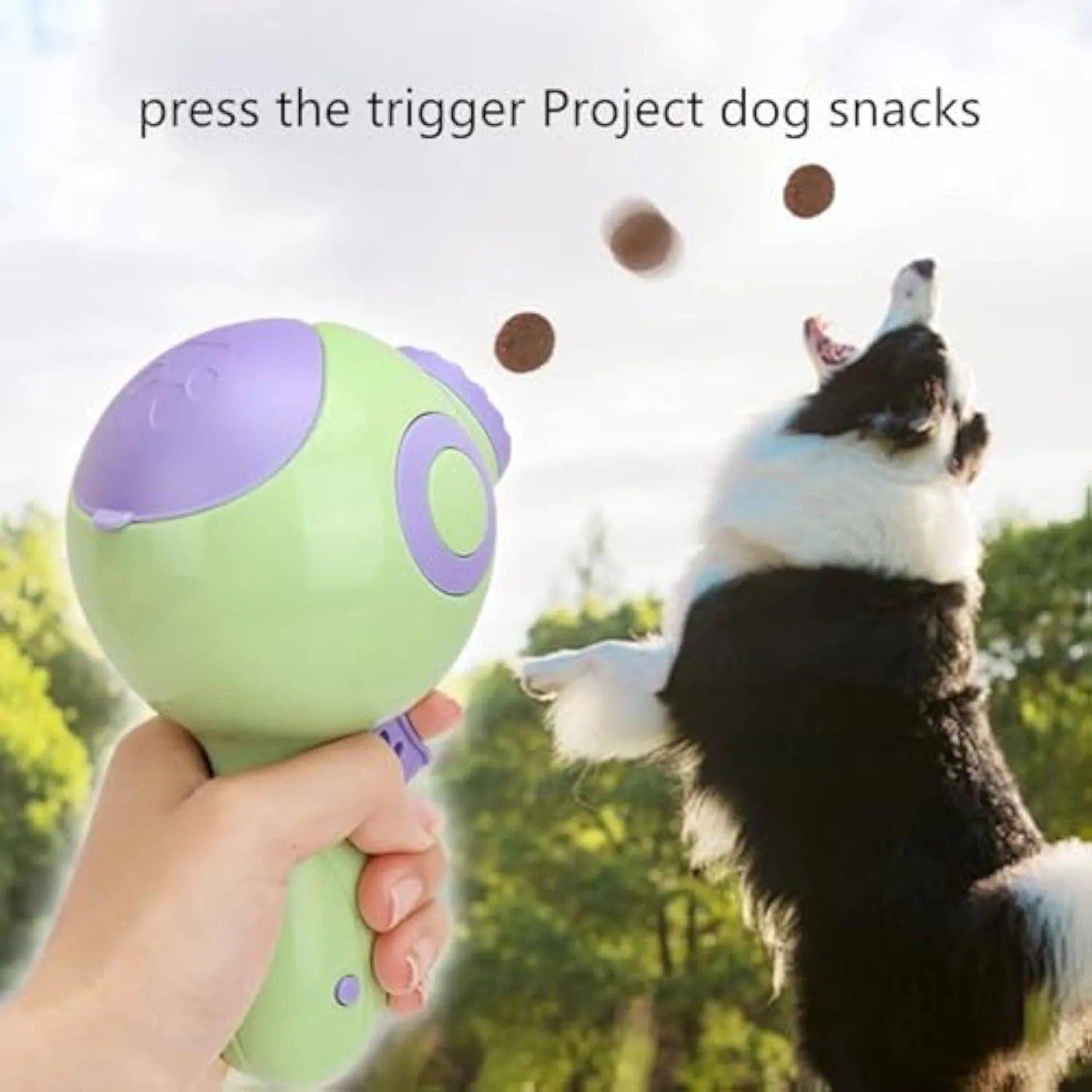 Green, orange and pink dog treat launcher toy for interactive training and slow feeding