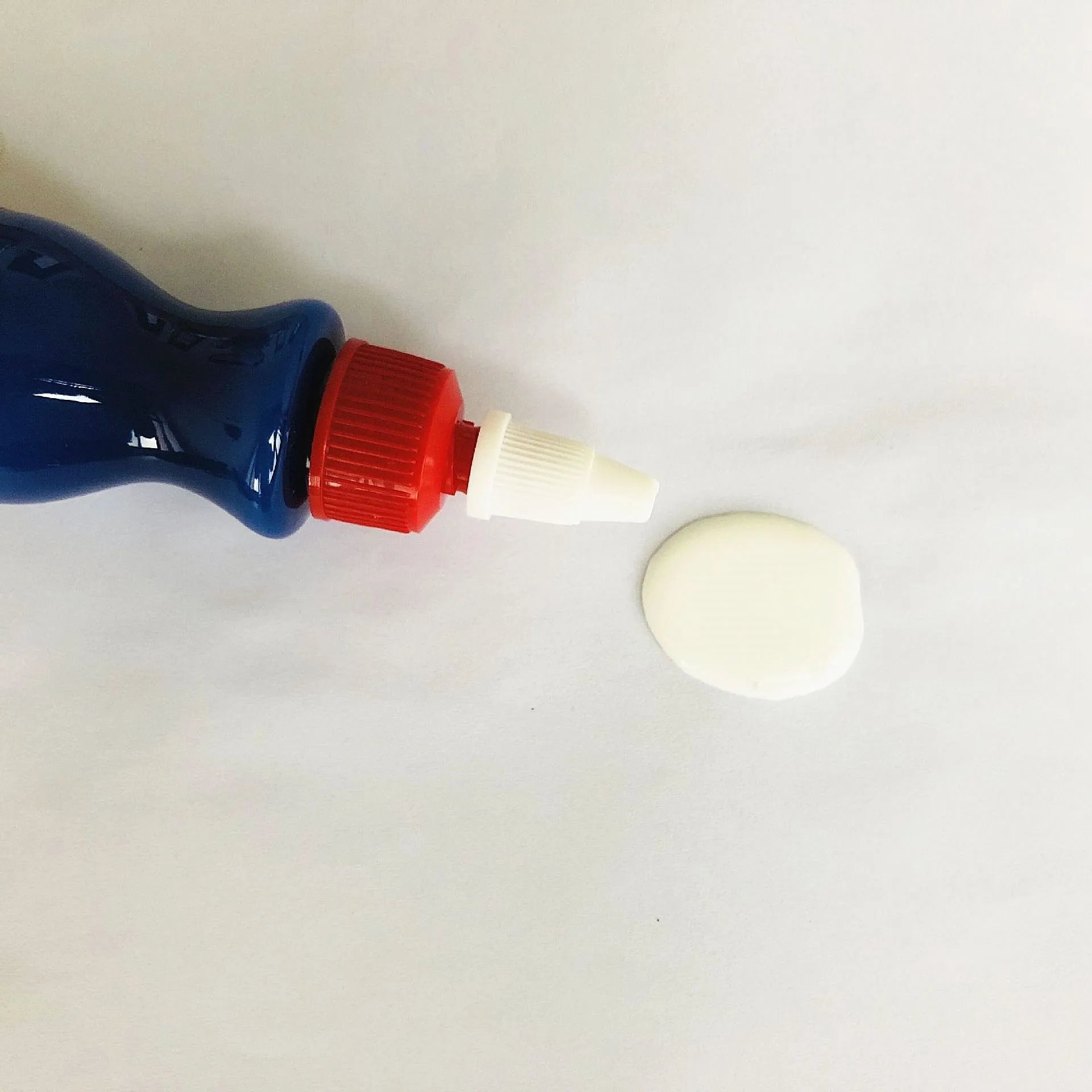 Blue car wiping tool with microfiber applicator and scratch repair agent bottle for automotive paint damage