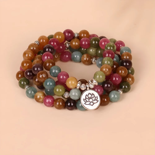 108-bead alloy bracelet with a multi-layer lotus charm in a natural tourmaline colour.