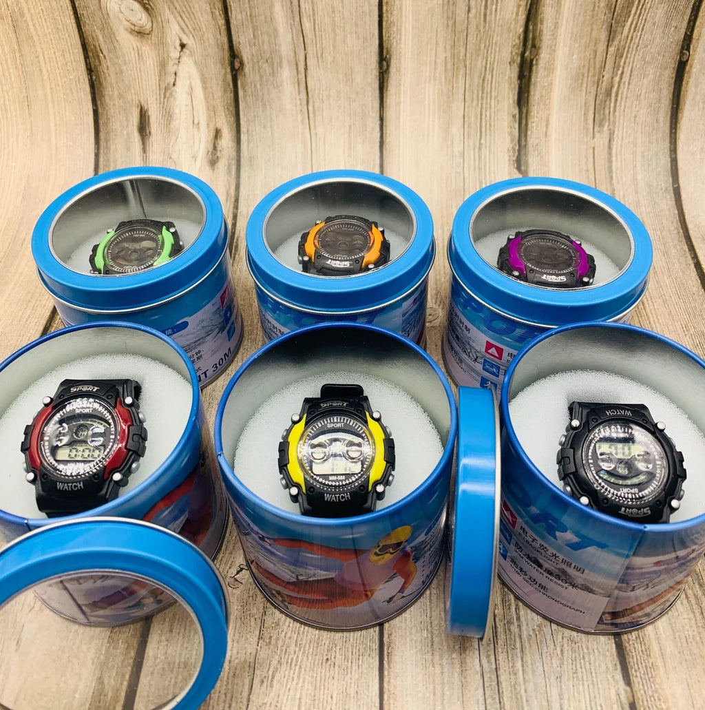 Children's digital sports watch with silicone strap and plastic case on wrist.
