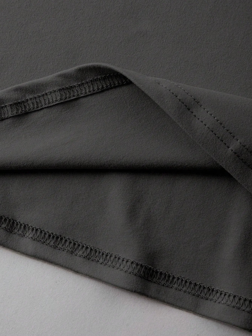 A loose-fitting cotton t-shirt with short sleeves and a round neck, shown in assorted colours.