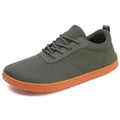 Men's low-top casual walking shoes in black with Flyknit upper, round toe, and rubber sole on a plain background.