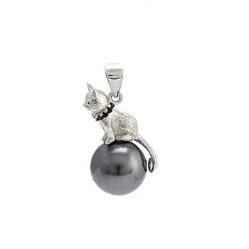 Close-up of a sterling silver cat pendant on a clavicle necklace chain.
