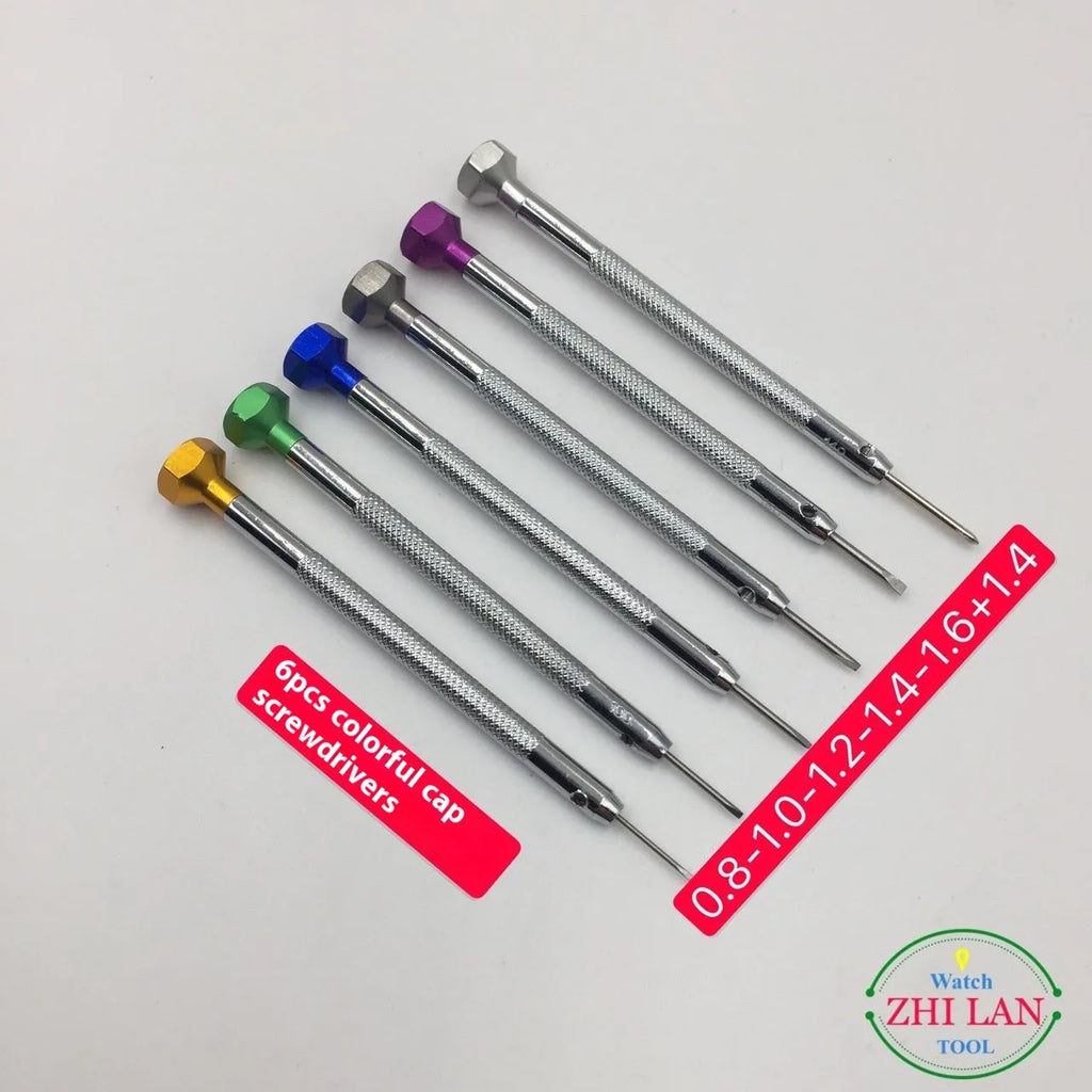 Six colour-coded watch repair screwdrivers with copper handles arranged in aluminium case