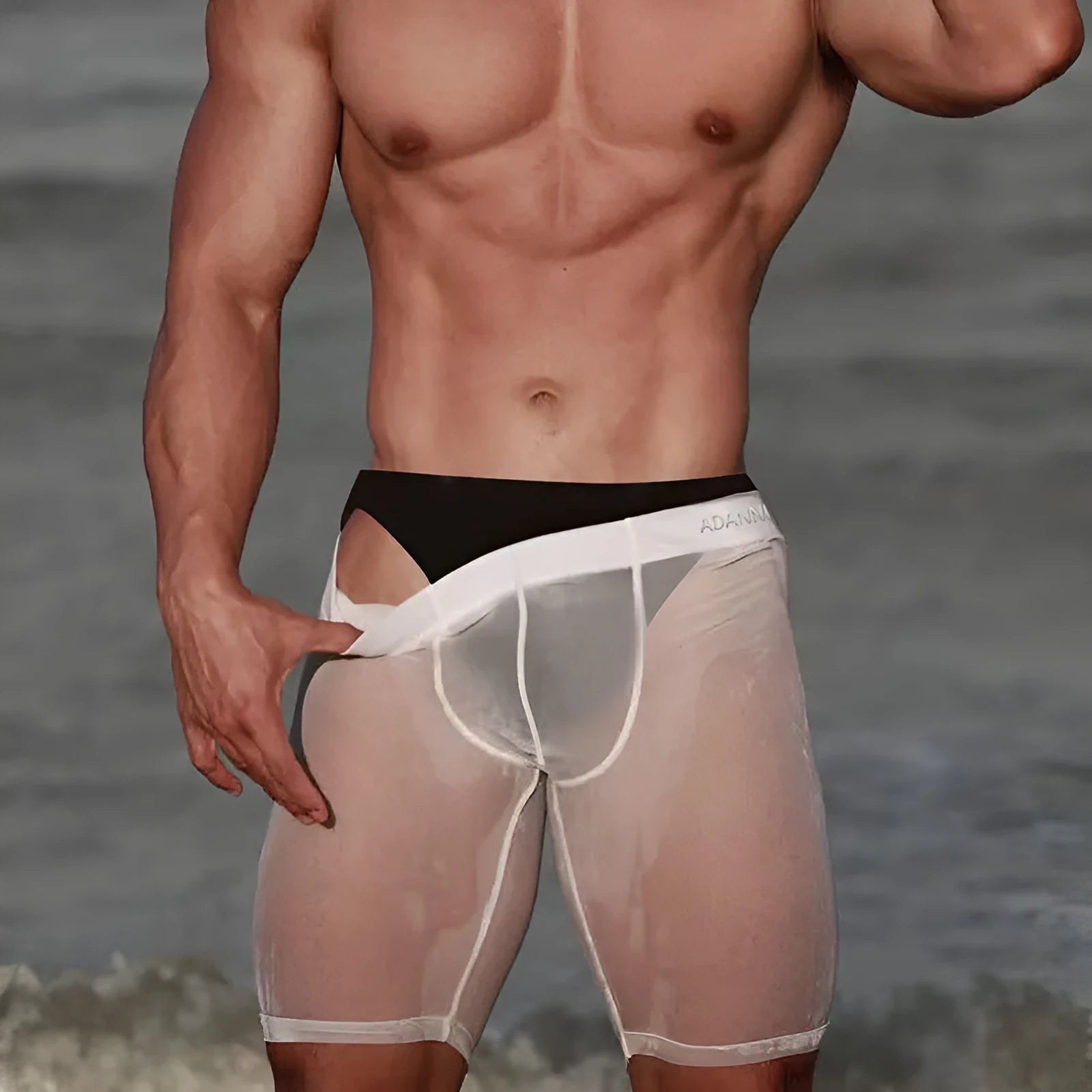 Men's solid colour mesh shorts with seamless construction and a hip-lifting fit, shown in black.