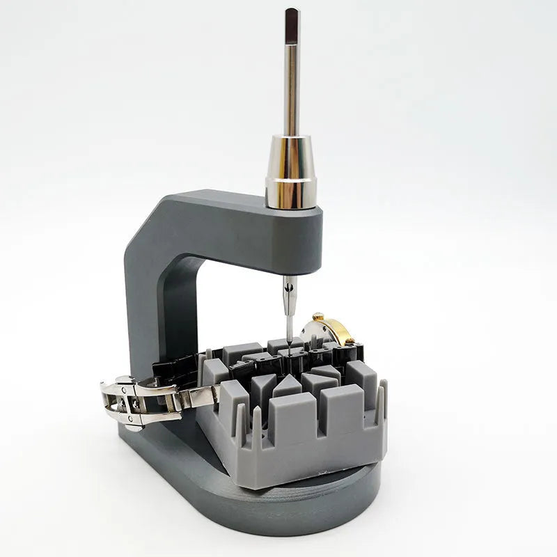 Silver tool steel press strap removal tool with 0.50-1.60mm blade specification on a work surface.