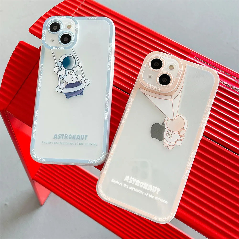 Transparent silicone iPhone case with astronaut print in blue, showing phone's original colour through clear background