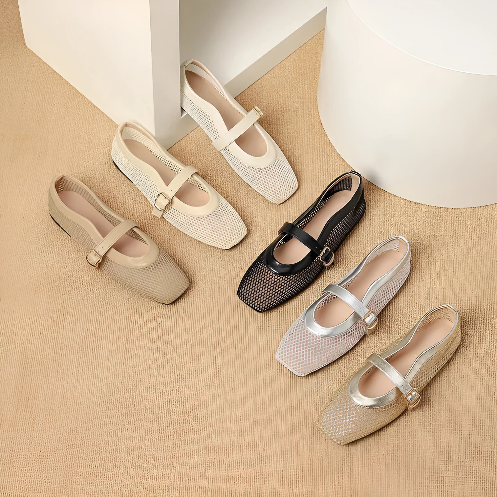 Women's beige mesh flat-heel pumps with square toe and buckle fastener on a white background.