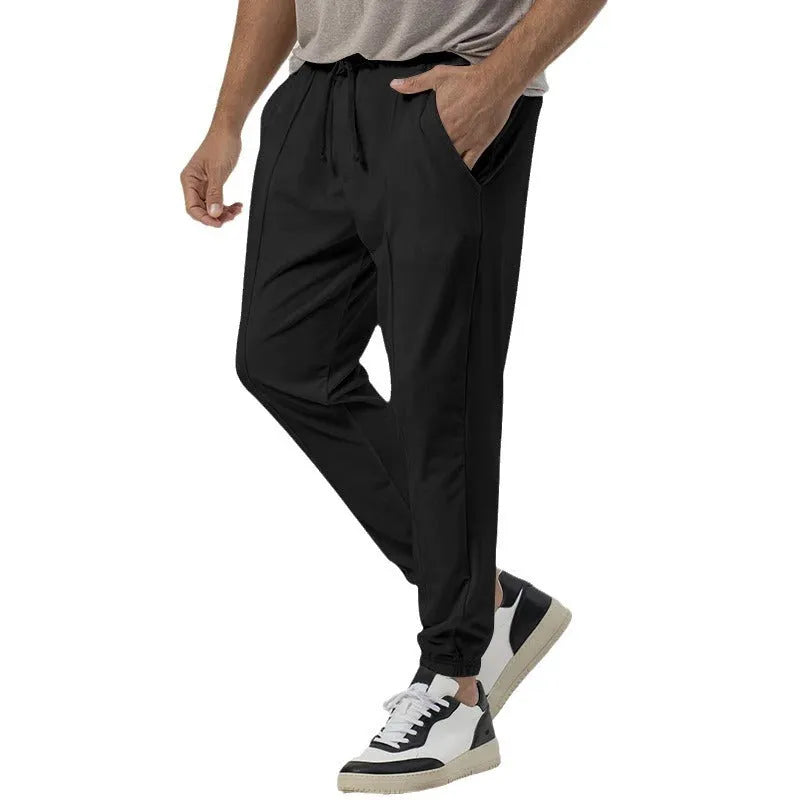 Men's grey cotton blend track sweatpants with straight leg design and mid waist