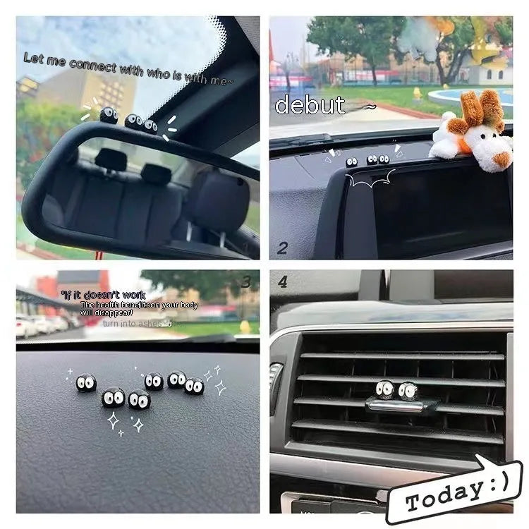 Small black cartoon-styled resin briquette car decoration ornament with traceless glue tape on a surface.