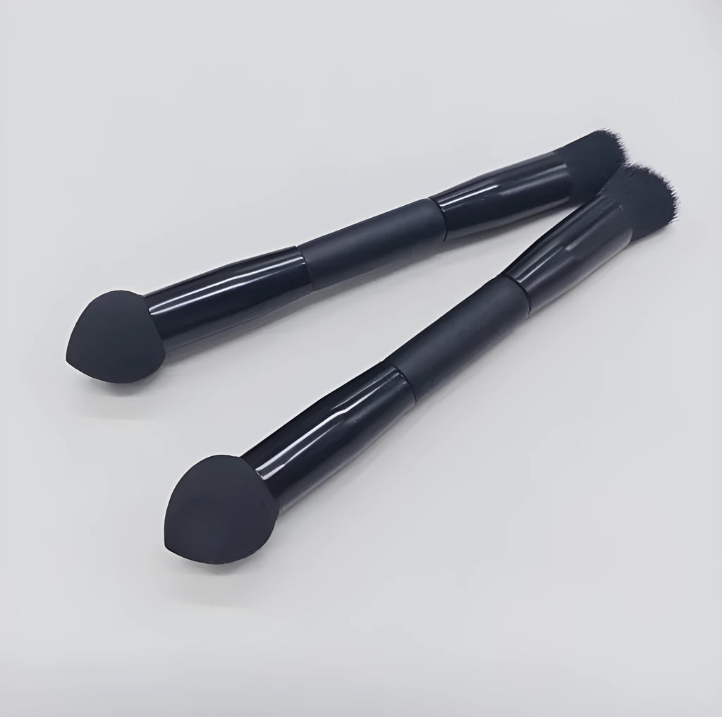 Elegant black double-headed makeup brush with a concealer brush and angled miter sponge on a wooden handle.