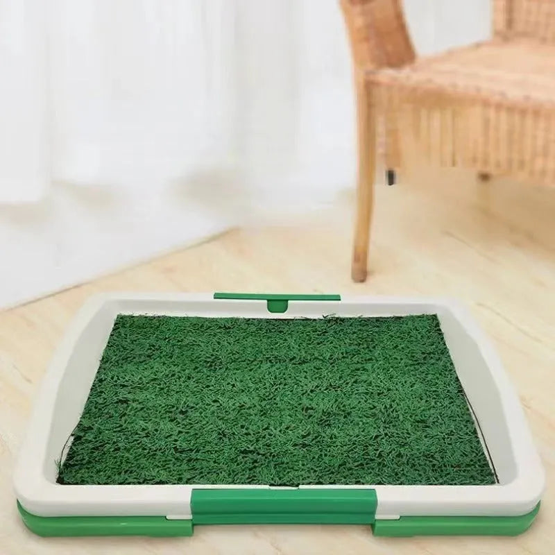 Green artificial grass indoor dog toilet training tray with three-layer construction.