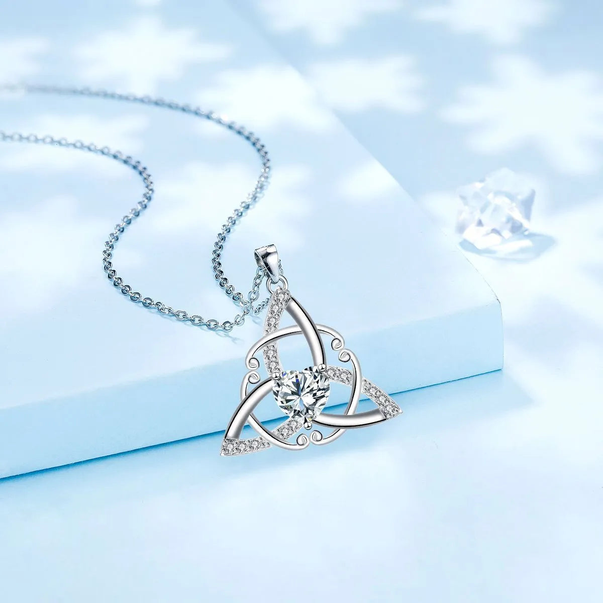 Women's geometric Celtic knot pendant necklace in copper with electroplated blue finish