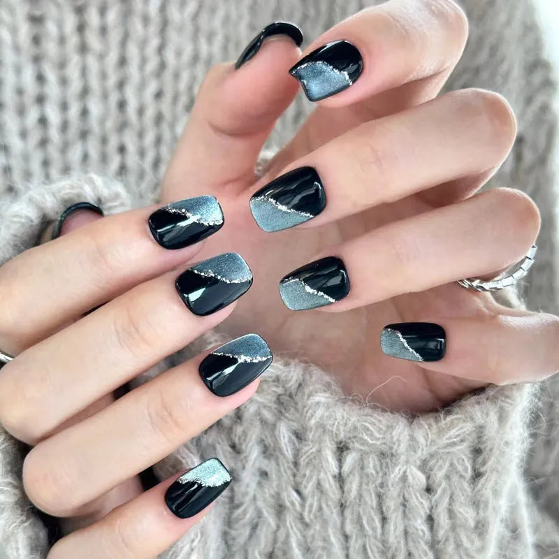 Set of sweet girl theme fake nails with colourful glitter and crystal decorations on a soft gel base.