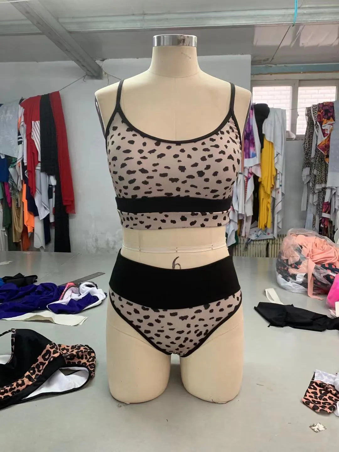 Women's high waist split bikini swimsuit in leopard print and white colours