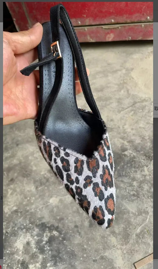 Leopard print suede women's sandals with pointed toe design on foot