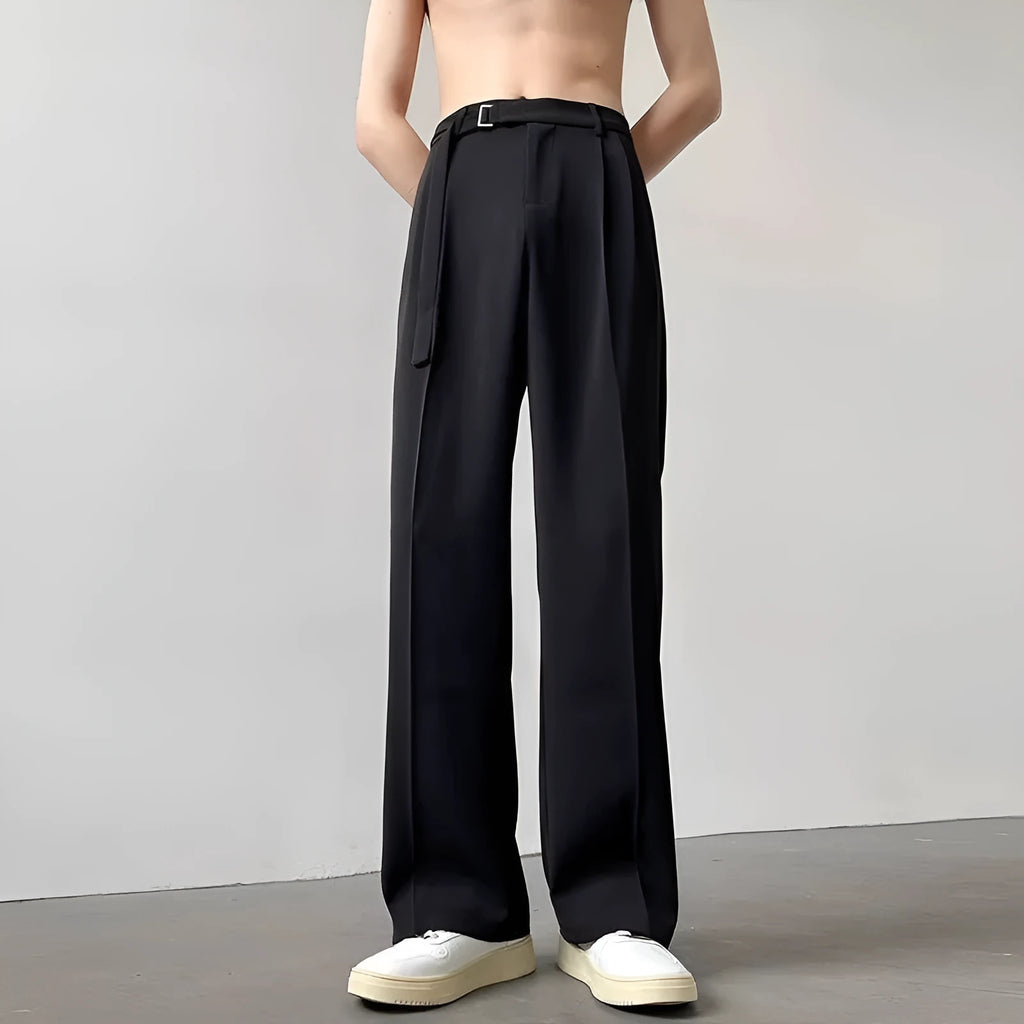 Black wide leg straight trousers with a loose fit on a hanger.