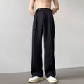 Black wide leg straight trousers with a loose fit on a hanger.