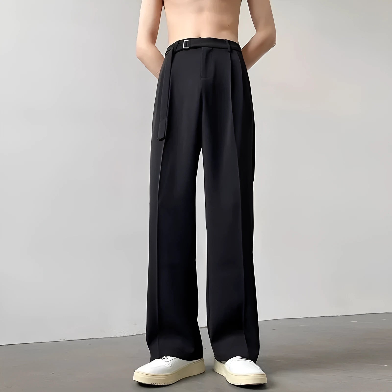 Black wide leg straight trousers with a loose fit on a hanger.