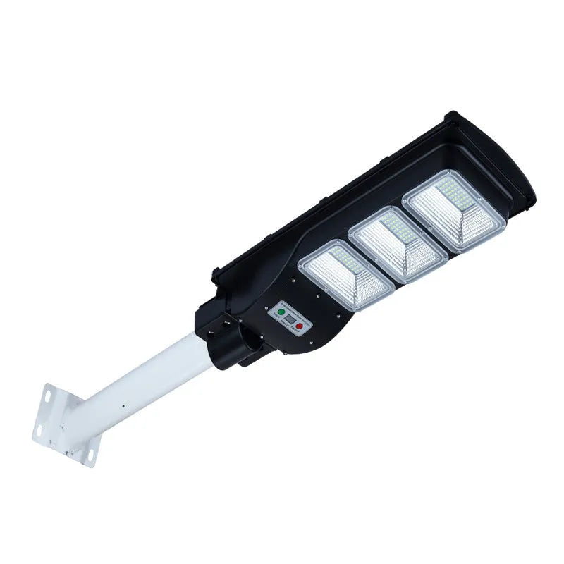 Integrated solar street light with 60W LED panel and remote control for outdoor pathway illumination.