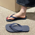 Men's casual flip flops with toe covering in PVC material, showing non-slip sole pattern and full foot enclosure design