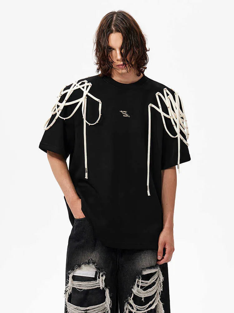 Black loose-fit short-sleeved T-shirt with padded shoulders and rivet ribbon detail.