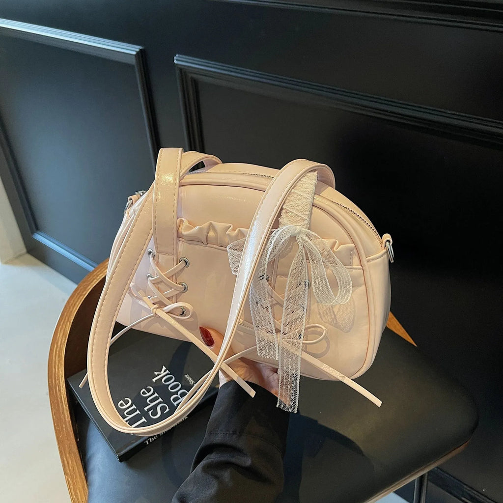 Women's fashion handbag with bandage bow design and mobile phone compartment in selected colour
