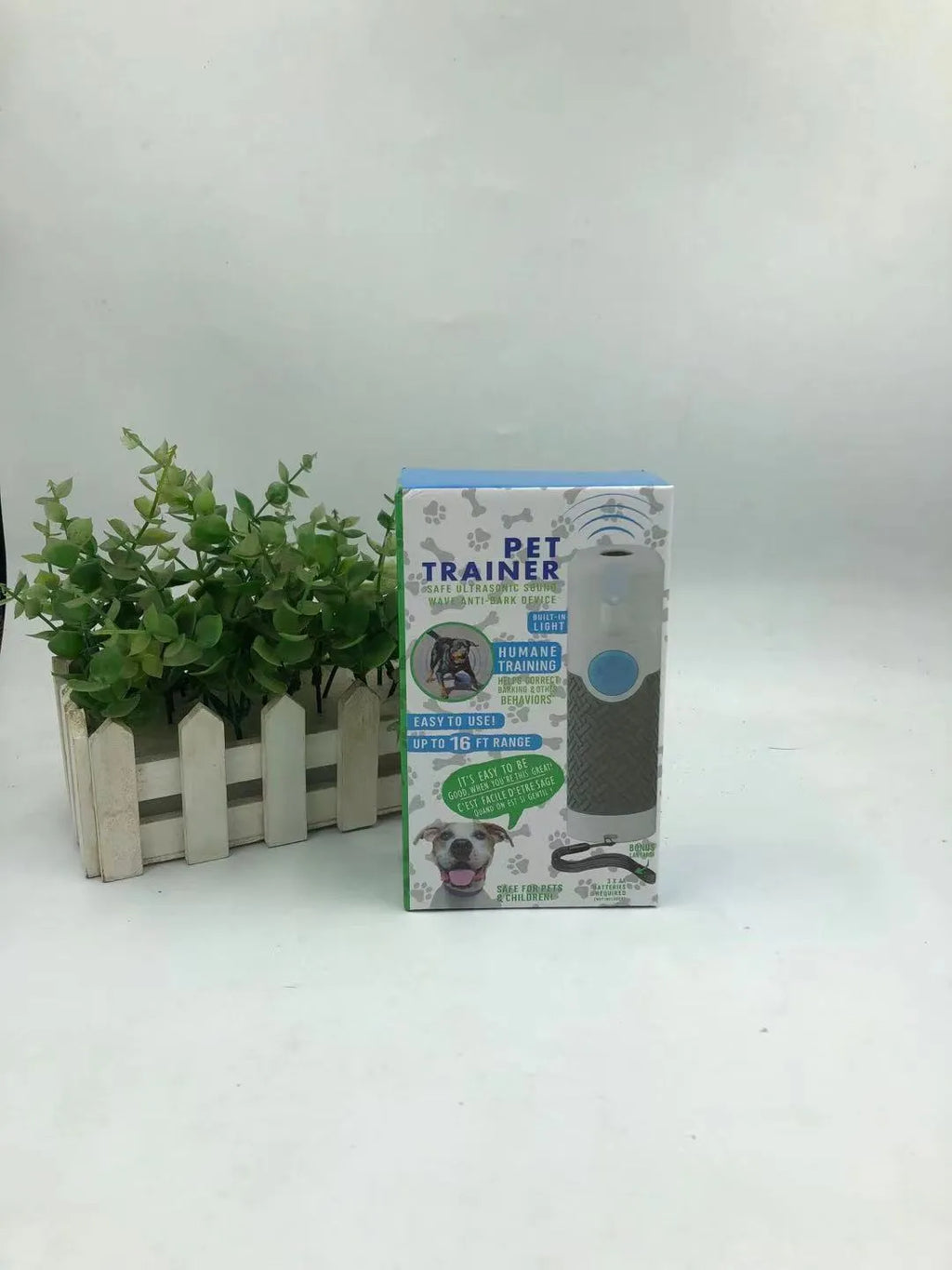 White handheld ultrasonic dog bark control trainer with ABS plastic casing