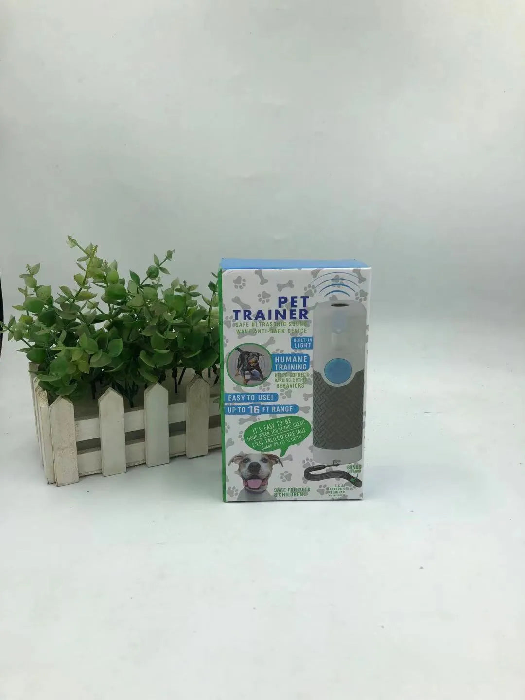 White handheld ultrasonic dog bark control trainer with ABS plastic casing