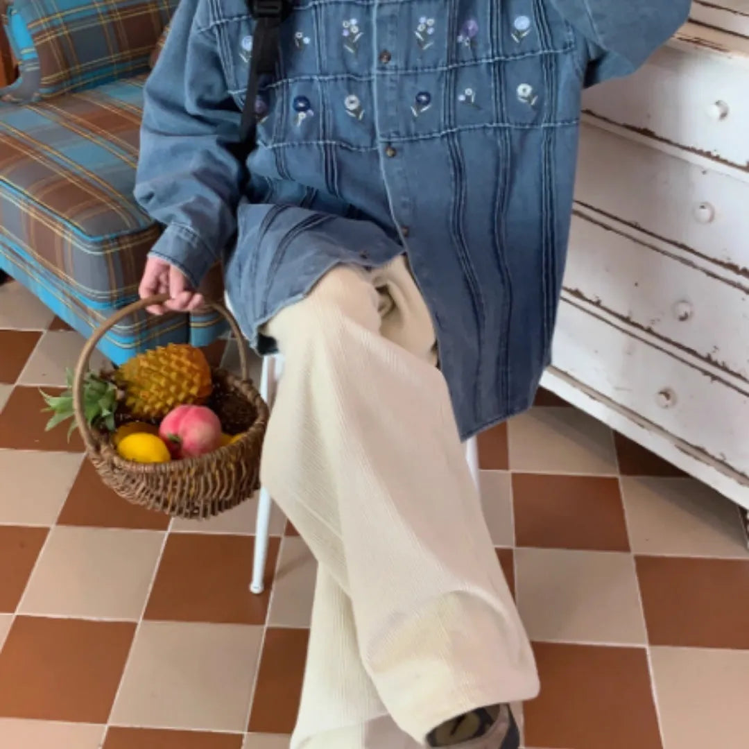 Vintage washed blue denim shirt with small floral embroidery and pleated front panel