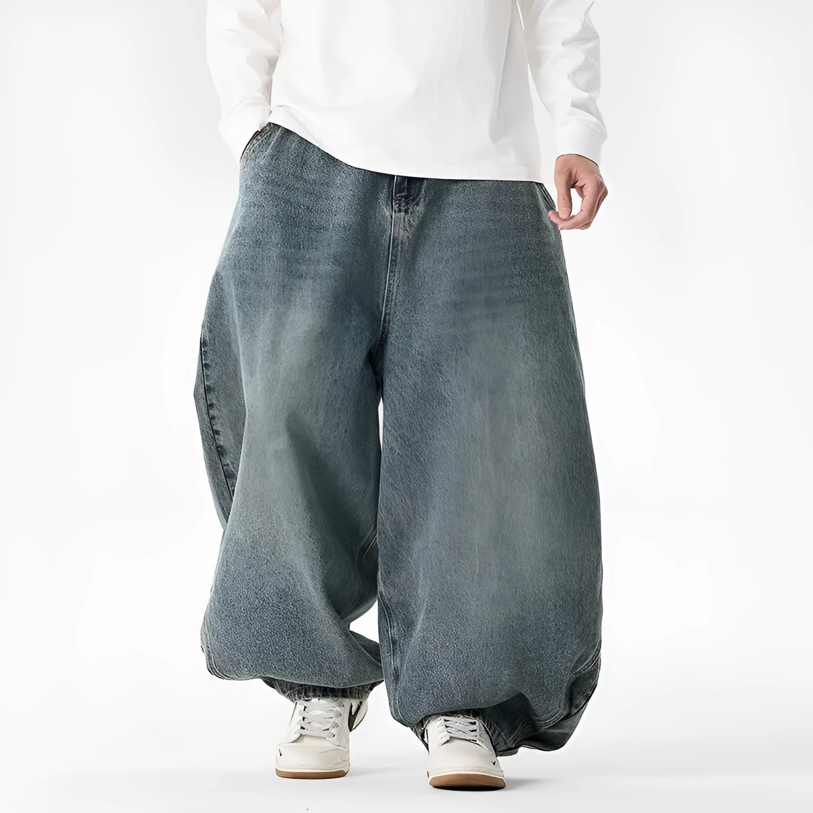 Men's plus size light blue wide leg baggy denim jeans with a low waist and straight leg opening.