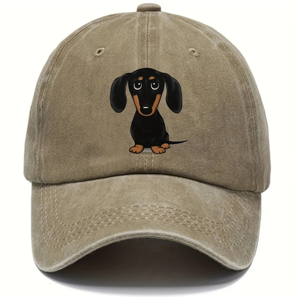 Retro washed blue cotton baseball cap with an embroidered brown dachshund design on the front.