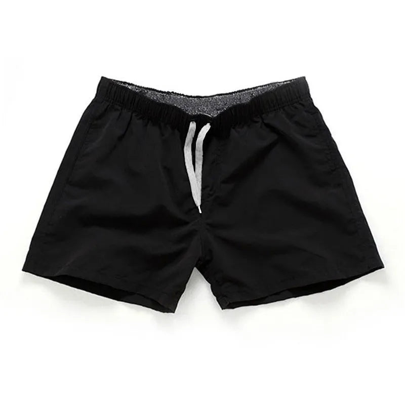 Men's polyester beach shorts in multiple colours with straight leg design for surfing and summer wear, available in sizes S to 4XL