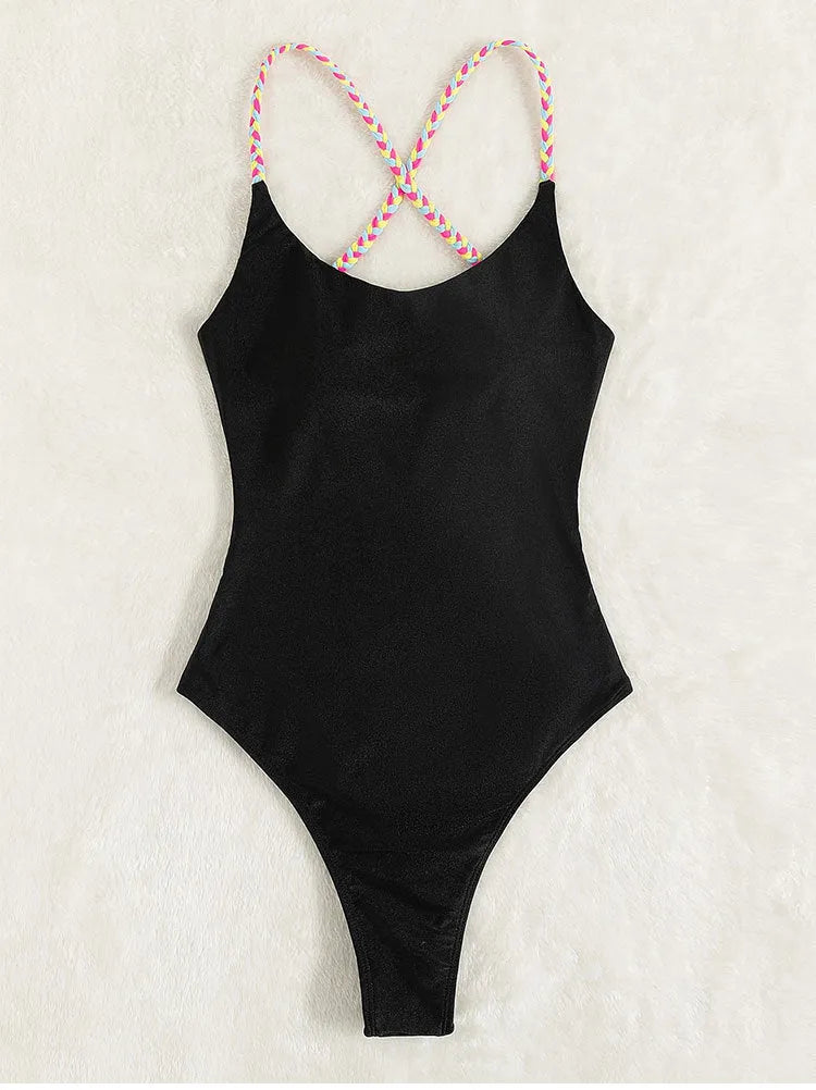 Black women's one-piece swimsuit with backless design and sleeveless construction