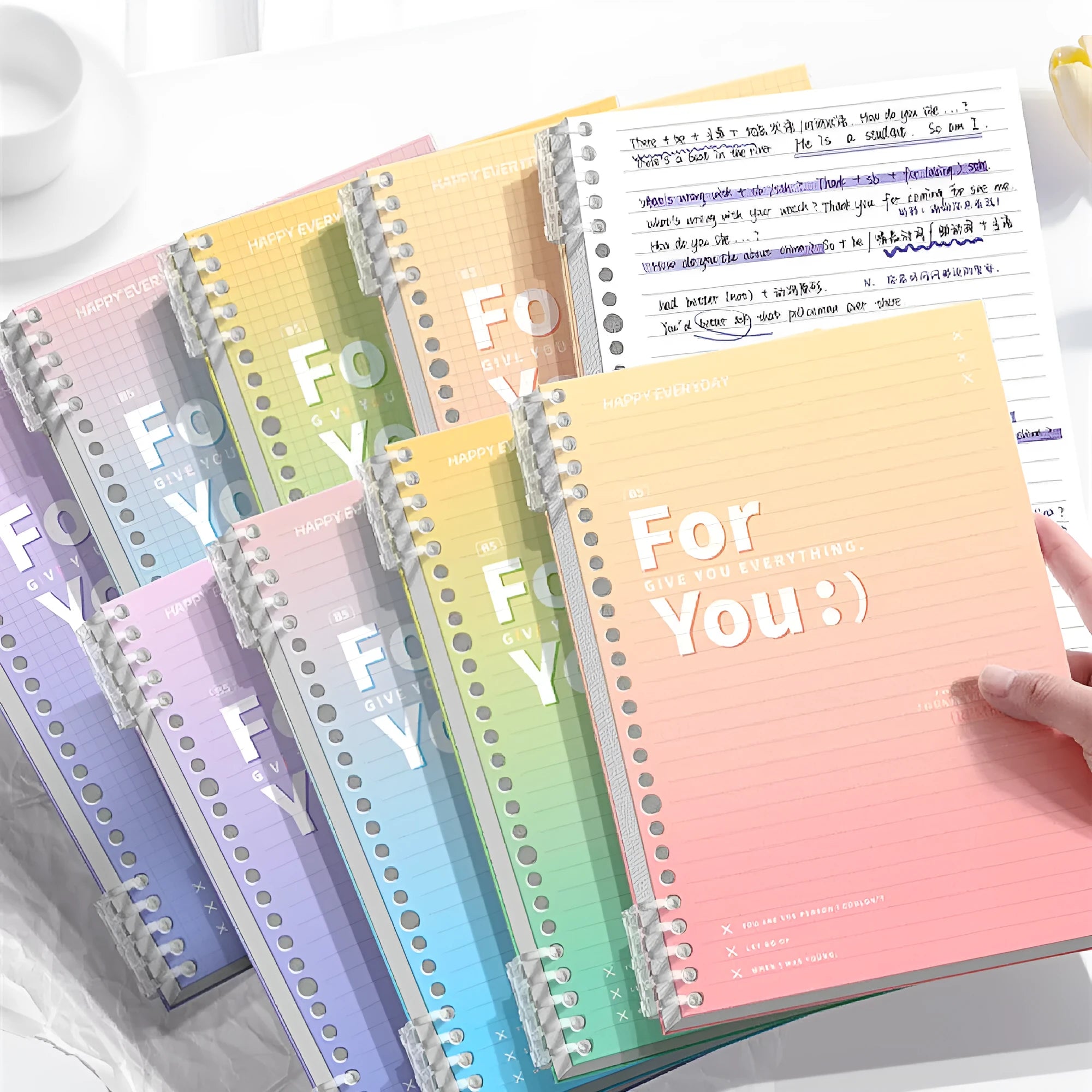 A4 and B5 removable coil notebooks with gradient coloured PP covers in green, blue, pink, and purple.
