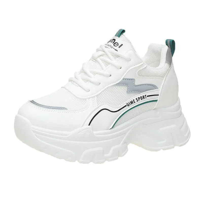 Women's white and beige dad shoes with lace-up front and rubber sole showing mesh material detail