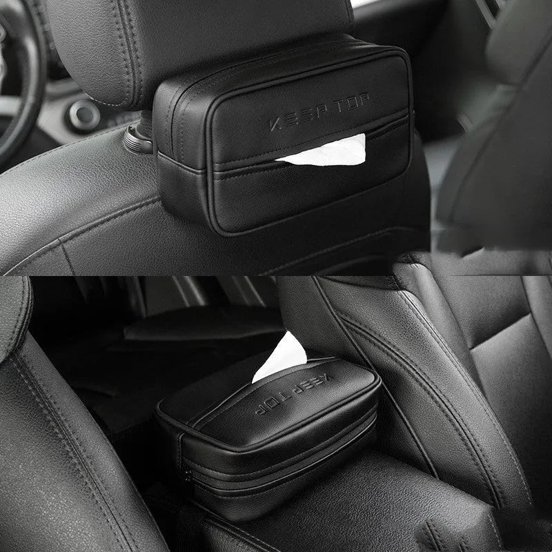 Black leather storage box with removable paper bag inside for car and home organisation.