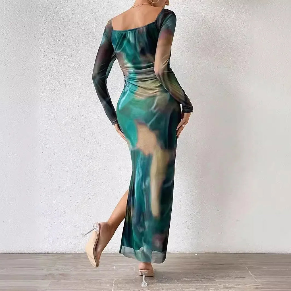 Woman wearing a printed gradient colour mesh fishtail dress with pleats and a square collar