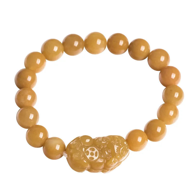 Golden Thread Jinsi Jade money bracelet with carved beads in two size options.