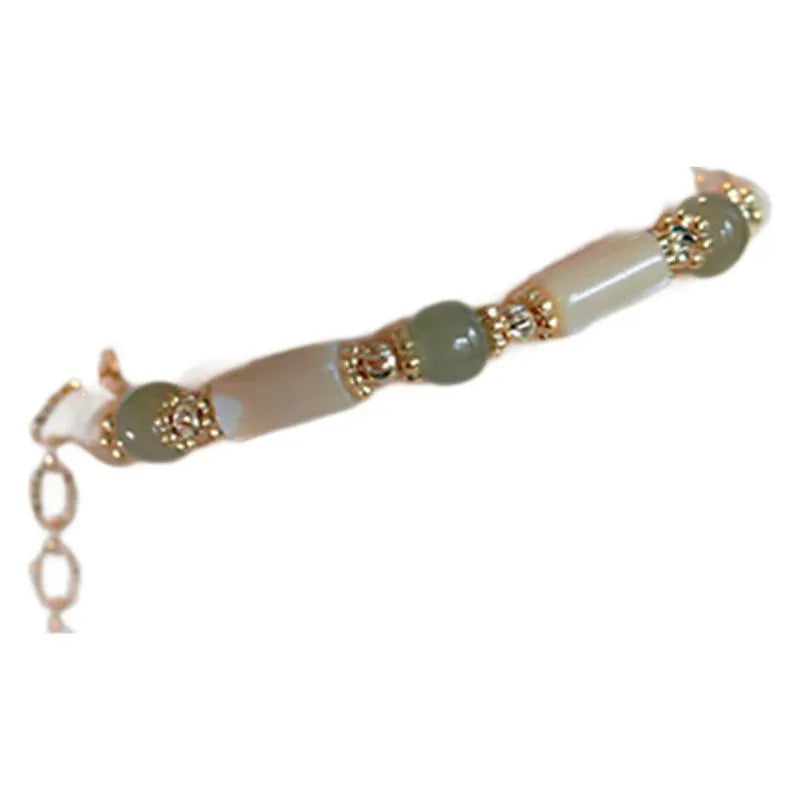 Natural Hetian jade white lip shell bracelet with round beads and simple geometric design