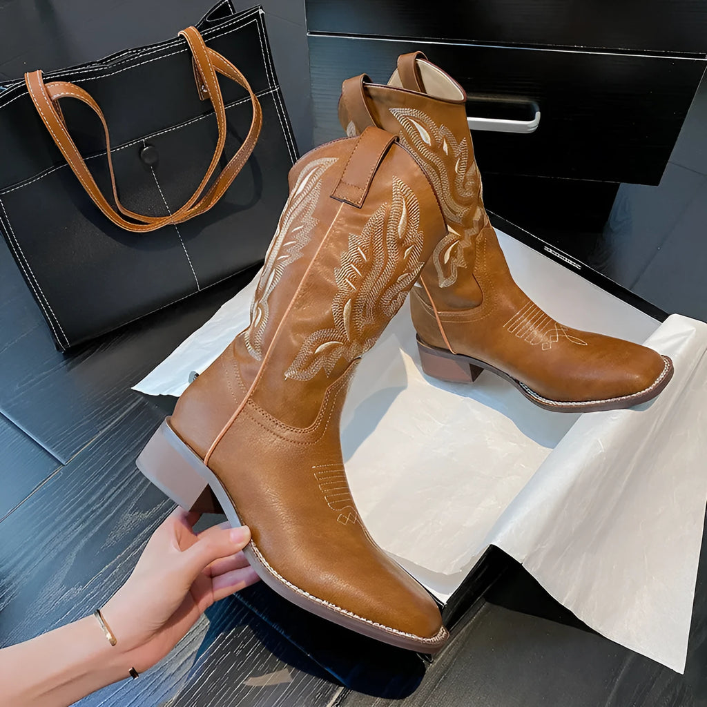 Brown women's mid-calf Martin boots with embroidered pattern and square low heel.