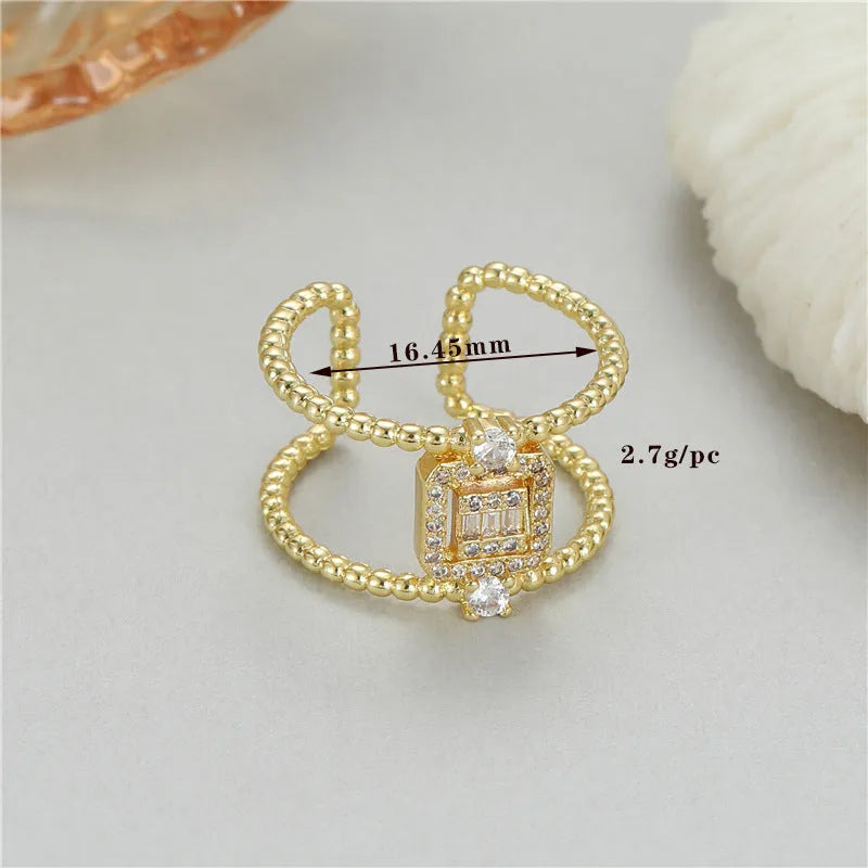 Copper open ring with adjustable opening and asymmetric U-shaped design in gold tone