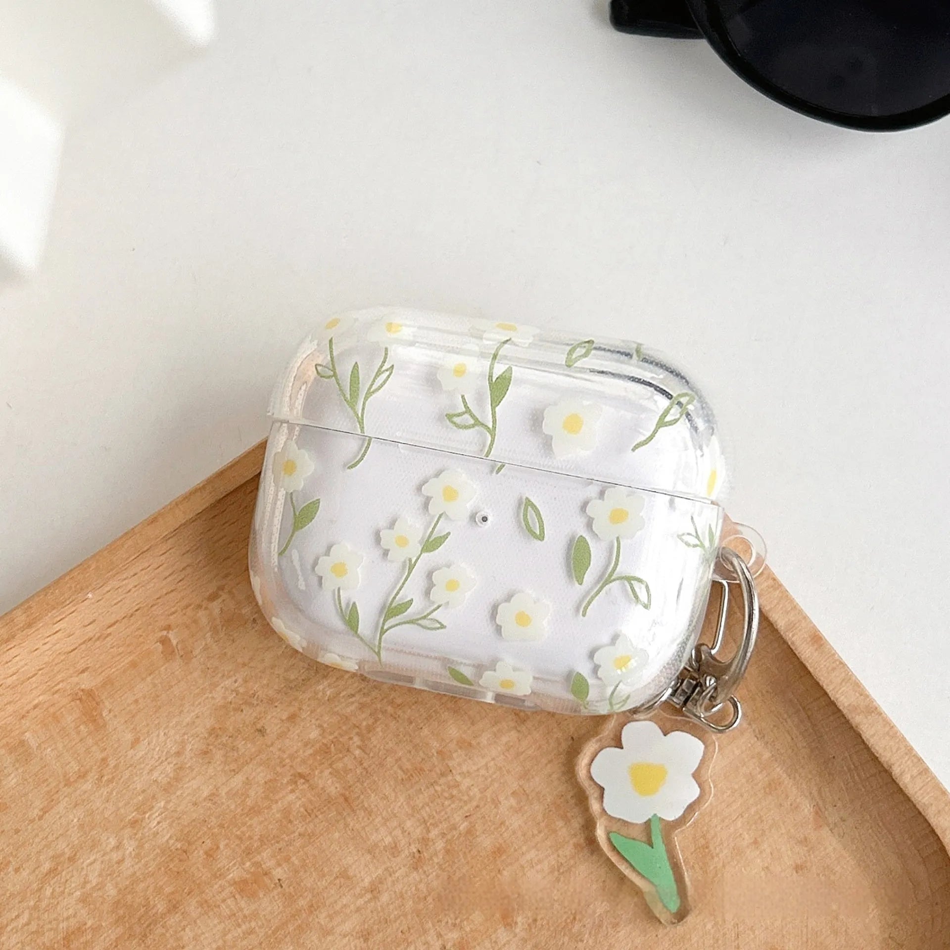 Transparent TPU AirPods case cover with white floral design showing compatibility with multiple Apple AirPods models